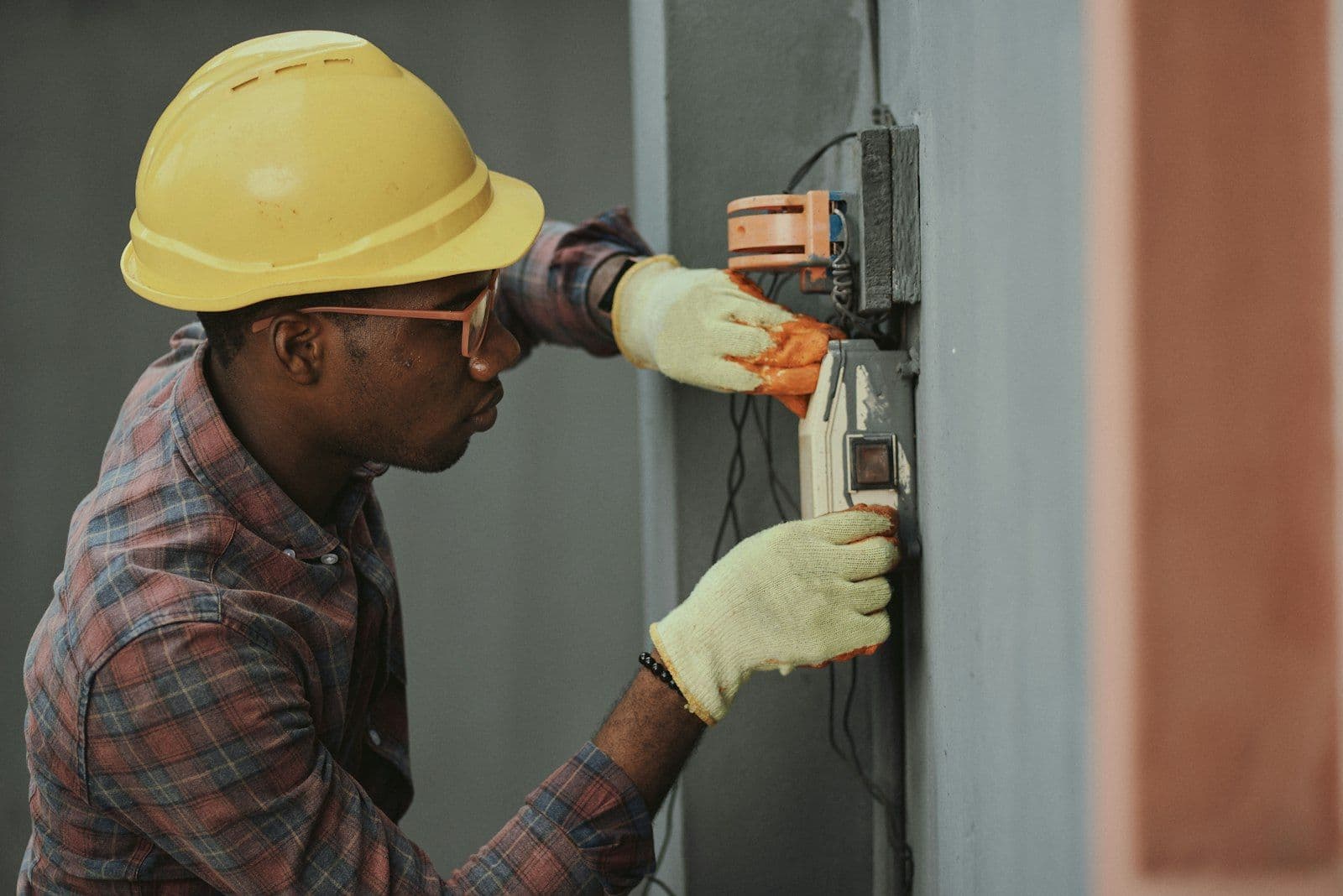 Electrician working on switchboard and solar connections